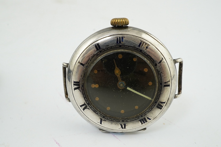 A George V silver military? manual wind wrist watch, case import marked for London, 1915, and a silver J.W. Benson manual wind wrist watch. Condition - poor to fair